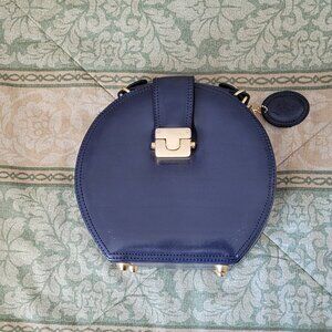 Dark blue handbag with brass trim